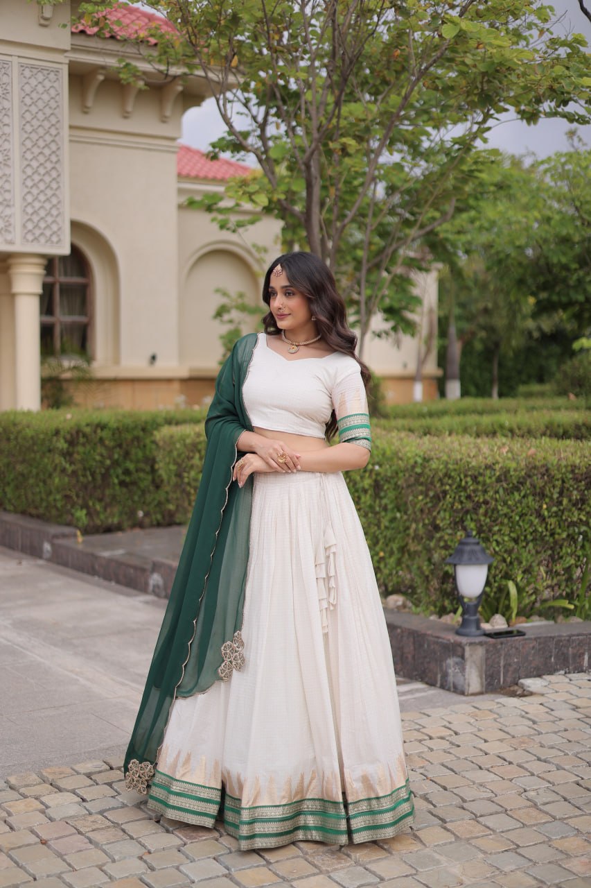 Comfortable and lightweight Elevate this Onam festive wardrobe with this elegant white Viscose jacquard lehenga choli with Dupatta set.