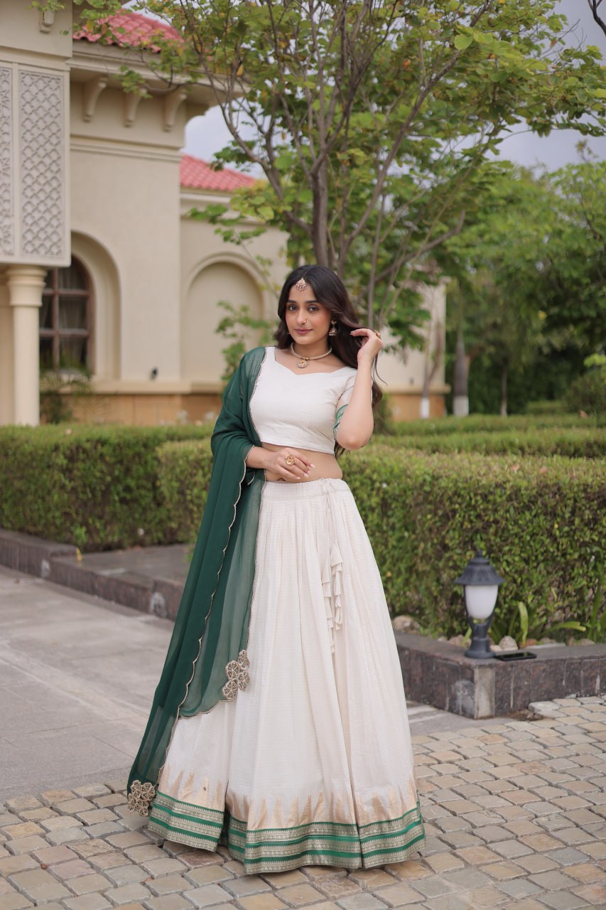 Comfortable and lightweight Elevate this Onam festive wardrobe with this elegant white Viscose jacquard lehenga choli with Dupatta set.