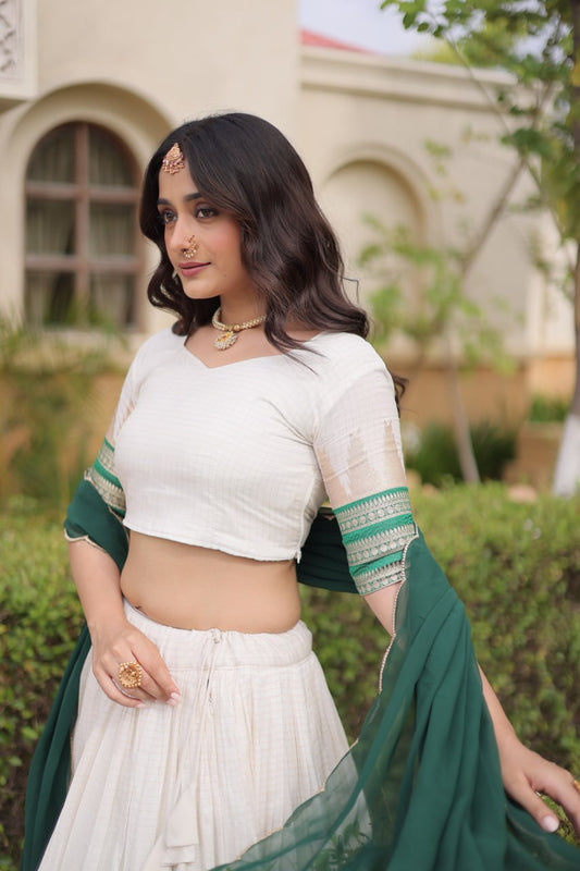 Comfortable and lightweight Elevate this Onam festive wardrobe with this elegant white Viscose jacquard lehenga choli with Dupatta set.