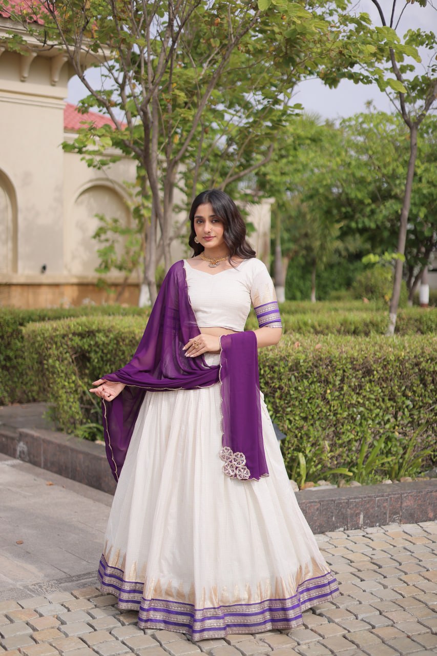 Comfortable and lightweight Elevate this Onam festive wardrobe with this elegant white Viscose jacquard lehenga choli with Dupatta set.