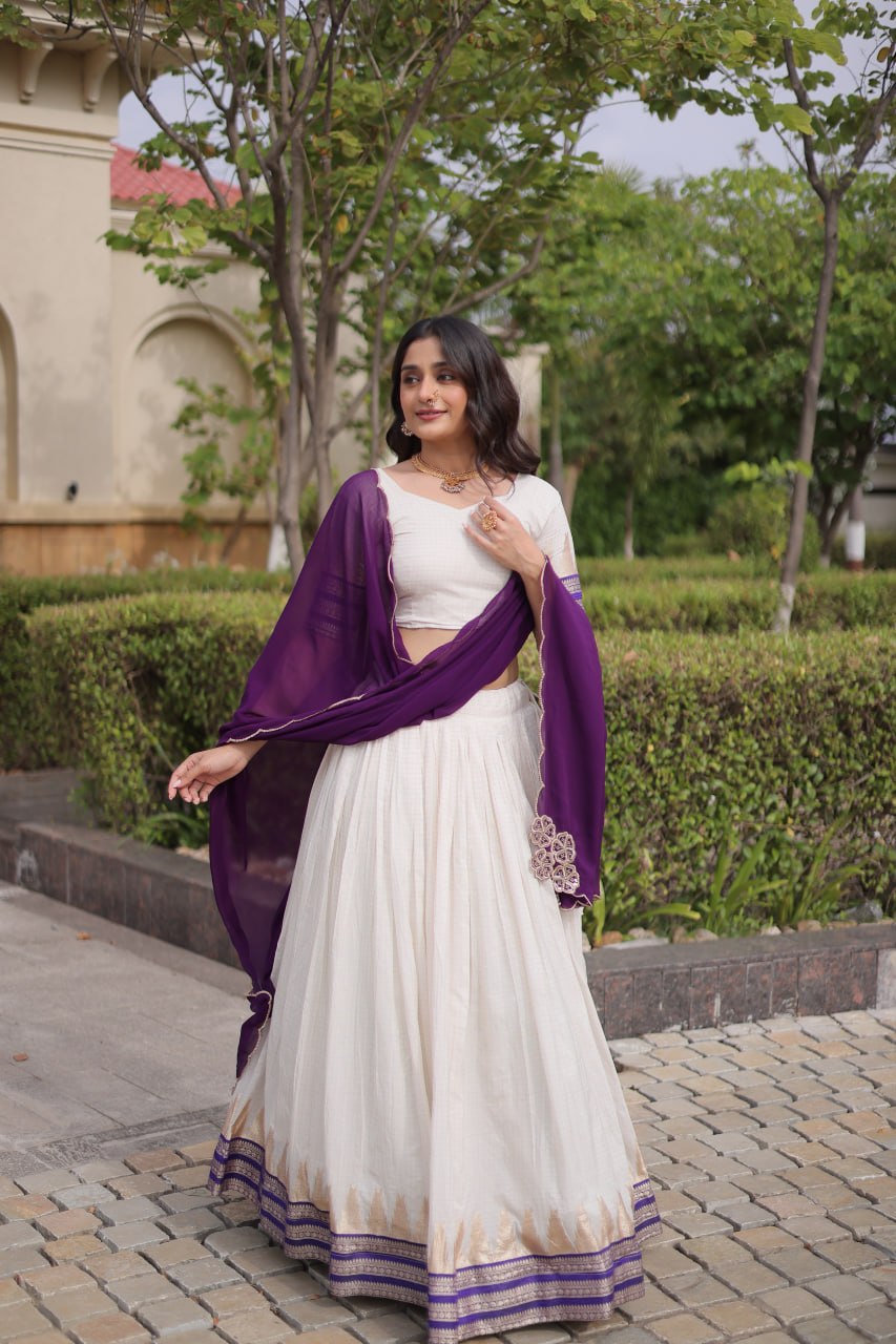 Comfortable and lightweight Elevate this Onam festive wardrobe with this elegant white Viscose jacquard lehenga choli with Dupatta set.