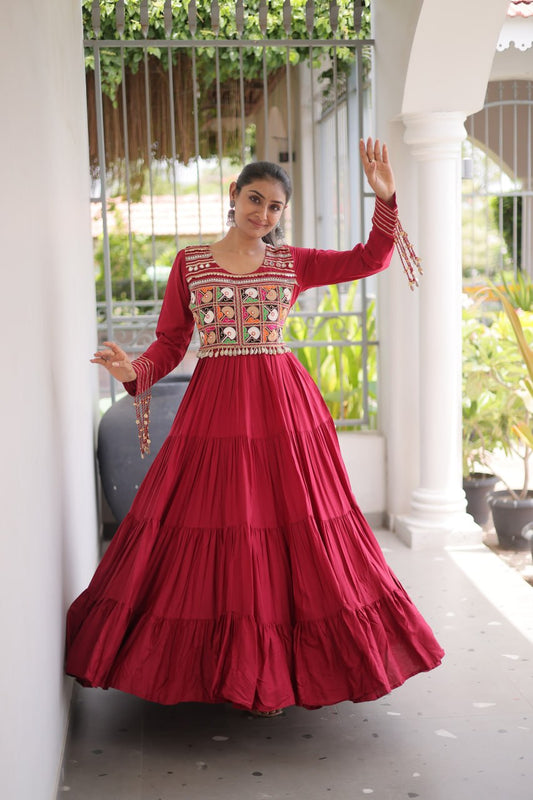 This White, Maroon & Black Colored Attractive Navratri Special Gown will surely fetch you compliments for your rich sense of style, Grab this gown before someone else gets it and wear it.